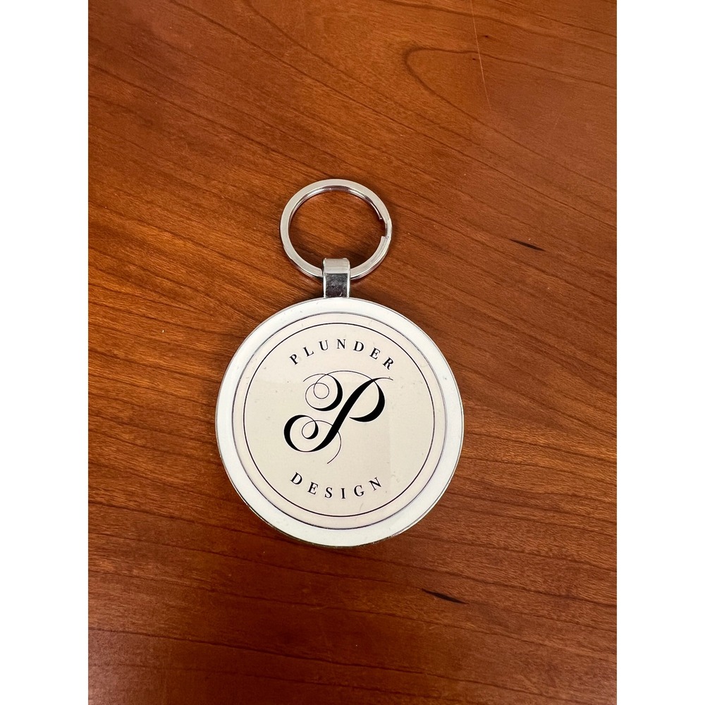 Plunder Design Keychain Silver Tone Round Logo Bag Charm Jewelry Accessory